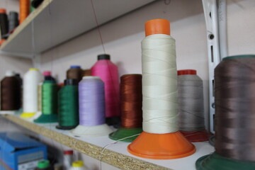 Colorful yarn on spool, yarn on tube, cotton, wool, linen thread