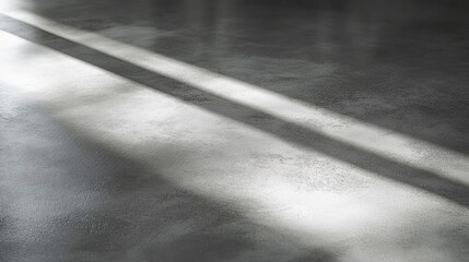 Concrete surface with diagonal light and dark shadows on display