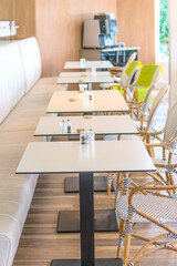 Tables and chairs in coffee shop cafe interior - Vintage Light Filter