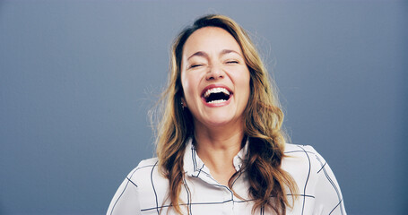Studio, woman and freedom with laughing for joke, funny and confident with comedy by mockup space....