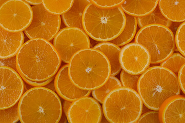 Vibrant orange slices create a colorful display of freshness perfect for summer recipes and healthy snacks