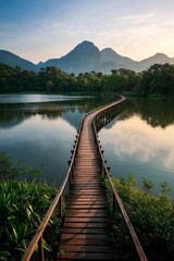 Fototapeta premium arafed wooden bridge over a lake with mountains in the background