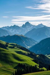 Obraz premium mountains with green grass and trees in the foreground