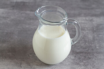 A jug of milk on grey background