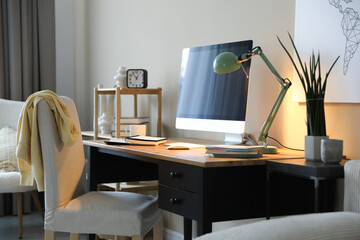 Comfortable workplace with modern computer in home office