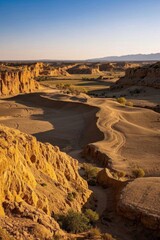 Fototapeta premium a view of a desert landscape with a few rocks and a few bushes