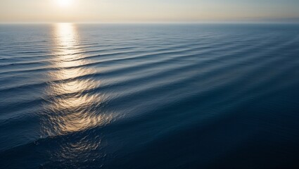 Fototapeta premium Waves glistening under the sun create a truly tranquil atmosphere.