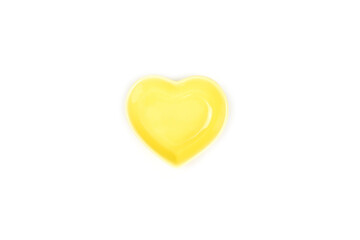 Top view, yellow heart-shaped bowls isolated on a white background. Template for food design, and banner. Use for home or restaurant..
