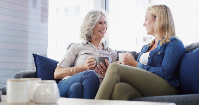 Home, senior mother and daughter with conversation, relax and bonding together in living room. Family, parent and women on couch, discussion or comfort with weekend break, reunion or coffee in lounge - Powered by Adobe