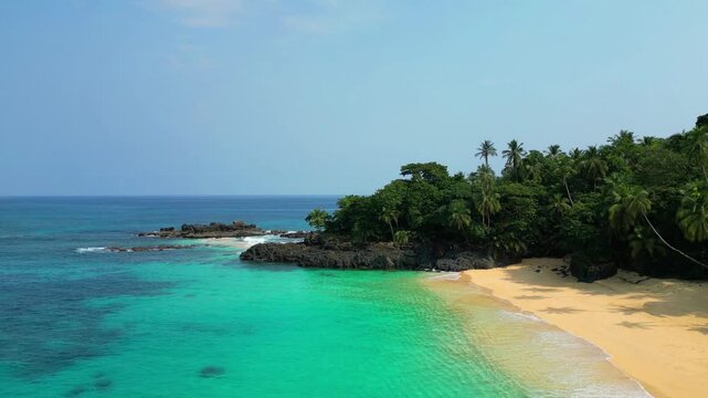 Aerial view from turquoise sea and green forest at Boi beah at Prince Island in Sao Tome e Principe,Africa