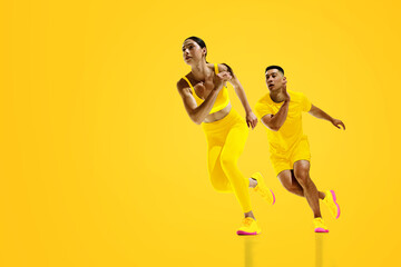Energetic collage. Two sprinters, man and woman, in yellow launching into race, perfectly...