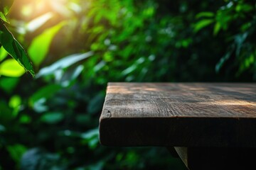Naklejka premium Wooden table top in lush green garden