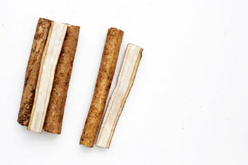 Burdock Root (Gobo) on white background.
