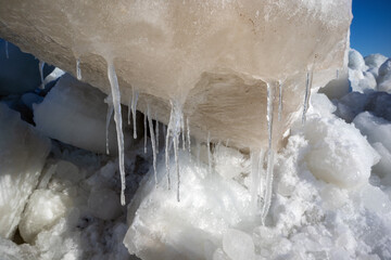 block of ice melting in early springtime sunlight