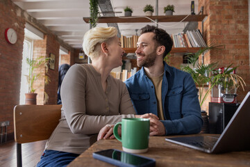 Happy couple celebrating a home loan approval