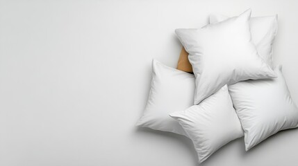 A visually appealing arrangement of white pillows stacked high, enhancing the cozy and comforting vibe of a serene indoor space with a gentle touch of elegance.