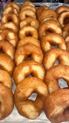 Fresh donuts in the box from the local bakery shop. Mixed freshly baked doughnuts with toppings.