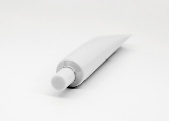Minimalist gray Cosmetic Tube on white Background