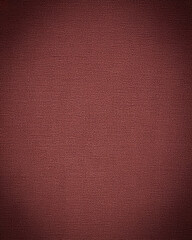 Fototapeta premium Rich maroon studio background featuring a textured weave and subtle vignette, adding depth and sophistication. Ideal for elegant backdrop wallpaper and professional photography.