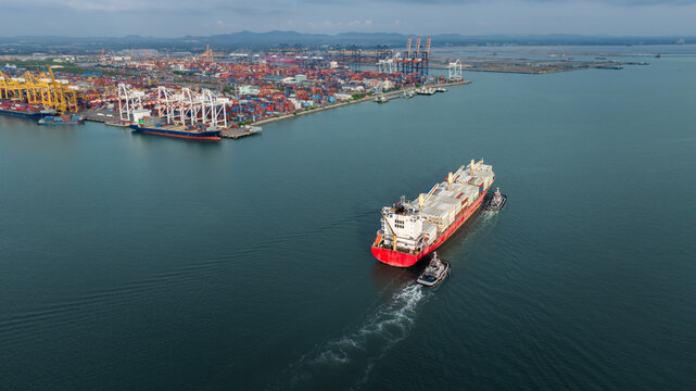 shipping container carrier container sailing enter commercial port, global business and industry delivery service of cargo logistics  to import and export by ship freight transportation.