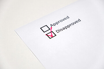 approved and disapproved, checkbox red marking on white paper