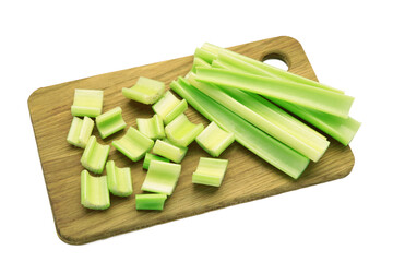 Fresh green cut celery on cutting board isolated on white background
