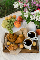 Summer picnic with fruits and pastries