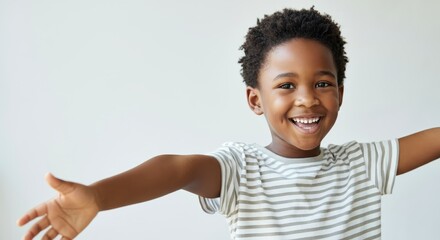 Happy african child with outstretched arms and striped shirt smiling joyfully