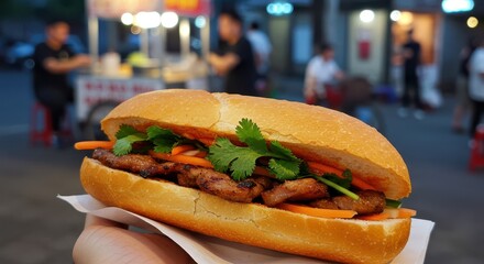 Holding a Delicious Meat Sandwich with Fresh Vegetables Outside at Night