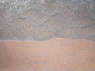 Top view Beautiful beach nature sea,Amazing landscape waves crashing on sand in summer background,Wide angle drone shot