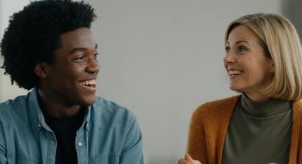 Fototapeta premium African male teen and caucasian female mature interaction in casual setting