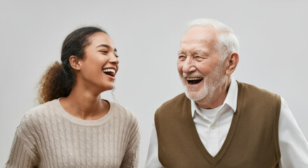 Fototapeta premium Joyful interaction between young hispanic female and elderly caucasian male