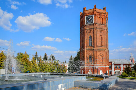City Clock Tower with a fountain in Yelets, Lipetsk region of Russia