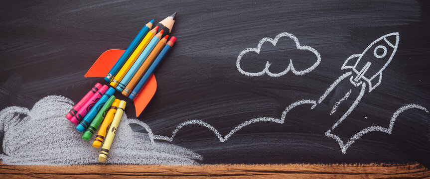 Colored pencils arranged as rocket launching from chalkboard, with chalk drawings of clouds and rocket trail, symbolizing education, creativity, and achieving goals - Powered by Adobe