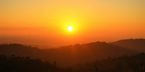 Golden sunrise over tranquil landscape, symbolizing enlightenment, mountains, new beginning