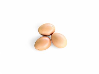 Three eggs are on the white background.