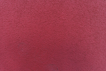 Fototapeta premium dark red textured wall providing background copy space for design projects. Vysocany district prague 9