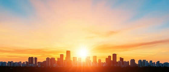 Obraz premium A stunning skyline at sunset with silhouetted buildings against a vibrant orange and blue sky.