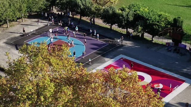 Aerial view of outdoor basketball court in urban park
