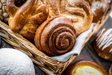 Fresh baked bread, various delicious freshly baked bread on white background, copy space. Variety of artisan bread composition, top view