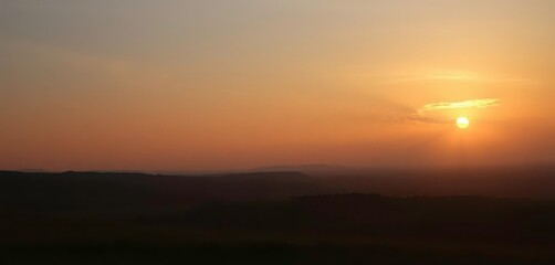 Golden hour light crests horizon, illuminating a landscape , learning, hope
