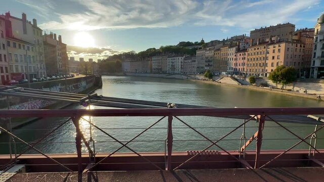 Walk on a bridge over Saone River in Lyon, France