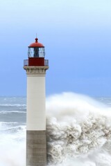 Fototapeta premium Majestic lighthouse braving monstrous waves, a symbol of strength against nature's fury.
