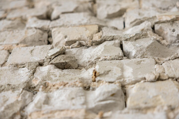 Old exterior brick wall. Old destroyed wall structure in vintage style. Abstract background texture texture. Old exterior wall. Abstract wall with painted grunge background.