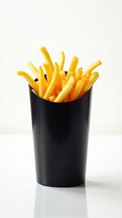 Crispy French Fries in Black Container Against Pure White Backdrop