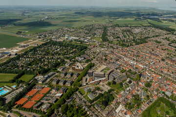 Aerial view of Zevenbergen showcasing urban and rural landscapes with residential areas and green fields in summer