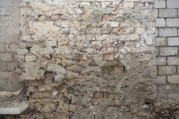 Old exterior brick wall. Old destroyed wall structure in vintage style. Abstract background texture texture. Old exterior wall. Abstract wall with painted grunge background.