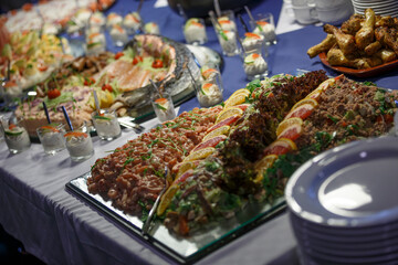 Lavish seafood banquet featuring a variety of dishes and vibrant presentation at an evening gathering
