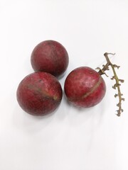 red longan, kelengkeng merah, dragon eye fruit. closeup. isolated on white background