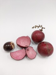 red longan, kelengkeng merah, dragon eye fruit. closeup. isolated on white background